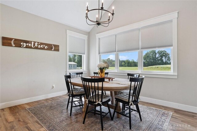 9782 E US Highway 22 And 3, Clarksville, OH 45113 - dining room with a chandelier, vaulted ceiling, and wood finished floors