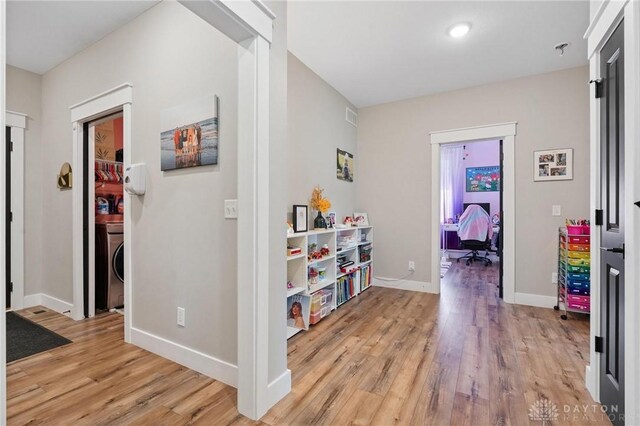 9782 E US Highway 22 And 3, Clarksville, OH 45113 - hall featuring light wood-style floors and washer / dryer