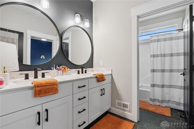 9782 E US Highway 22 And 3, Clarksville, OH 45113 - full bathroom with double vanity, tile patterned flooring, and shower / tub combo