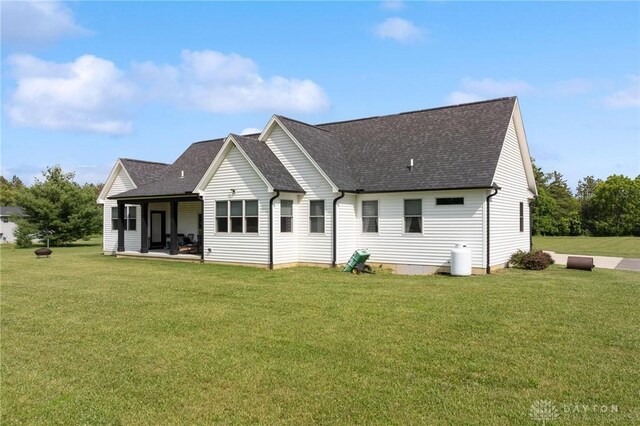 9782 E US Highway 22 And 3, Clarksville, OH 45113 - back of property featuring a shingled roof and a lawn