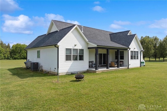 9782 E US Highway 22 And 3, Clarksville, OH 45113 - back of house with an outdoor fire pit, roof with shingles, a yard, and a patio