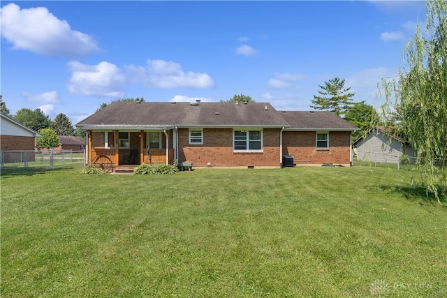 222 Alumni Cir, Wilmington, OH 45177 - back of property featuring brick siding, a fenced backyard, and a deck