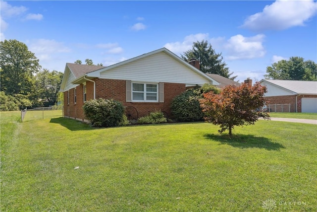 222 Alumni Cir, Wilmington, OH 45177 - view of home's exterior featuring brick siding and a chimney