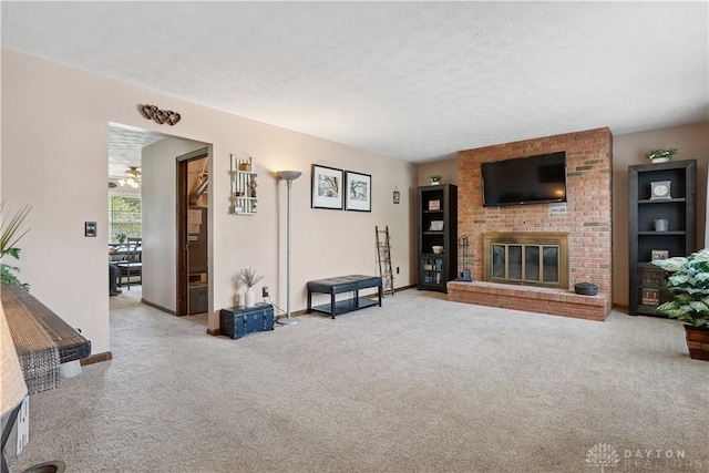 222 Alumni Cir, Wilmington, OH 45177 - living room with carpet flooring, a fireplace, and a textured ceiling