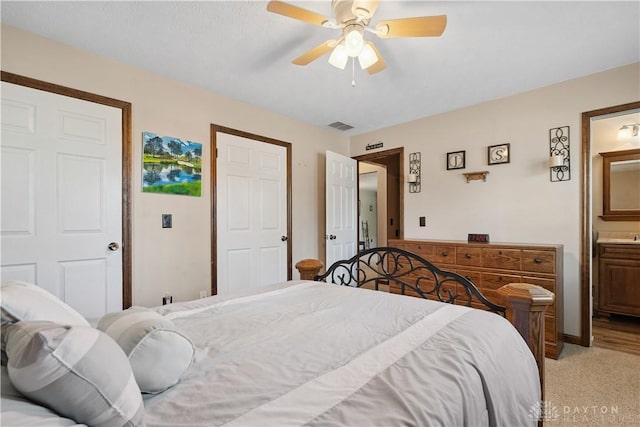 222 Alumni Cir, Wilmington, OH 45177 - bedroom featuring ensuite bath, light carpet, and ceiling fan