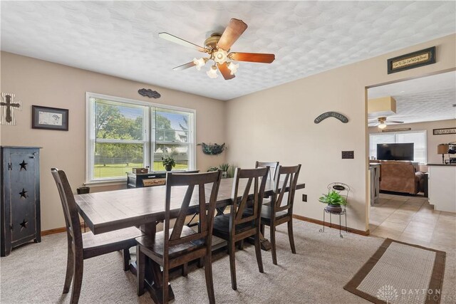 222 Alumni Cir, Wilmington, OH 45177 - dining area featuring a ceiling fan, a textured ceiling, and light colored carpet