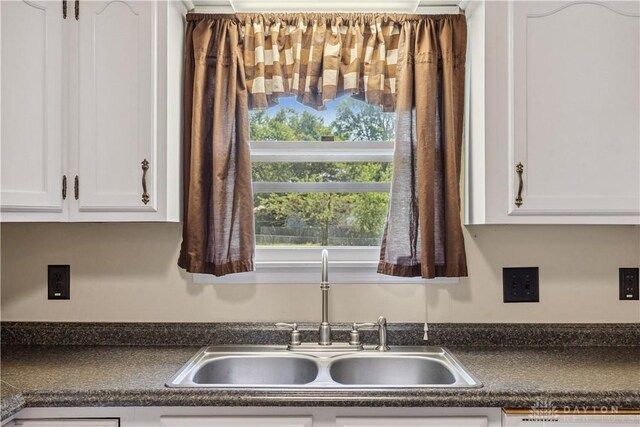 222 Alumni Cir, Wilmington, OH 45177 - kitchen view of dark countertops and white cabinets