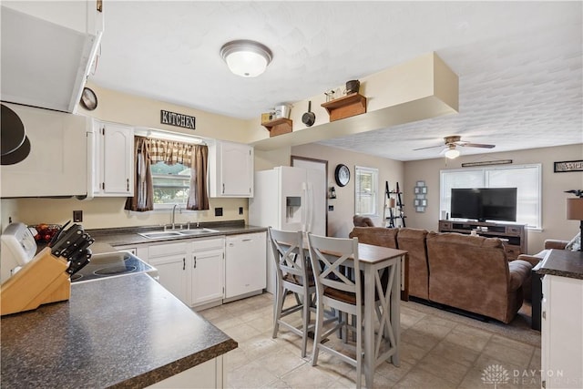 222 Alumni Cir, Wilmington, OH 45177 - kitchen featuring white appliances, dark countertops, a ceiling fan, white cabinets, and open floor plan
