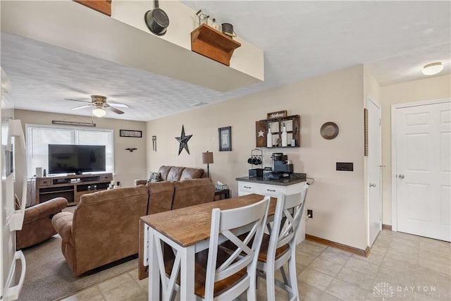 222 Alumni Cir, Wilmington, OH 45177 - dining room with a ceiling fan and baseboards