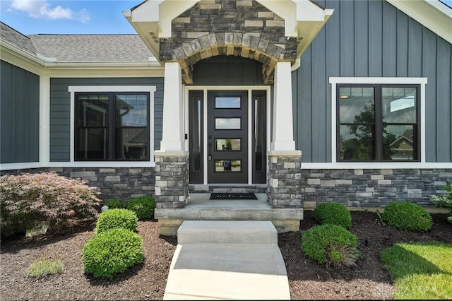 1471 Runnymeade Way, Beavercreek Twp, OH 45385 - entrance to property with stone siding, board and batten siding, and a shingled roof