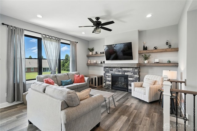 1471 Runnymeade Way, Beavercreek Twp, OH 45385 - living room with wood finished floors, a ceiling fan, a fireplace, and recessed lighting