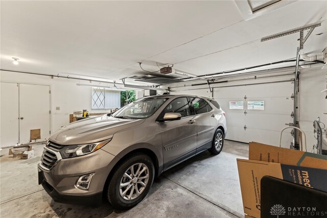 347 Winding Trl, Xenia, OH 45385 - garage featuring a garage door opener
