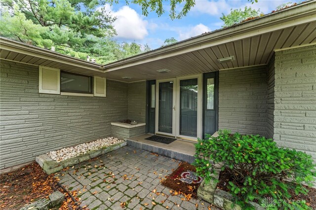347 Winding Trl, Xenia, OH 45385 - property entrance with french doors and brick siding