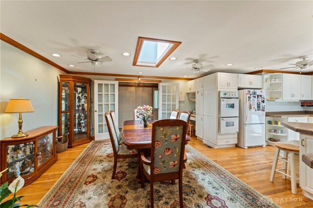 347 Winding Trl, Xenia, OH 45385 - dining room featuring recessed lighting, ceiling fan, crown molding, light wood-style floors, and a skylight