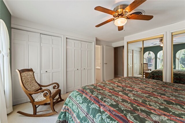 347 Winding Trl, Xenia, OH 45385 - bedroom with multiple closets, light carpet, and a ceiling fan