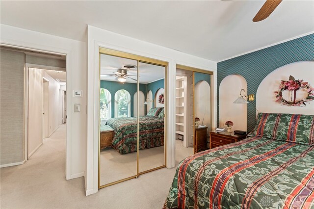 347 Winding Trl, Xenia, OH 45385 - carpeted bedroom featuring multiple closets, ceiling fan, and crown molding