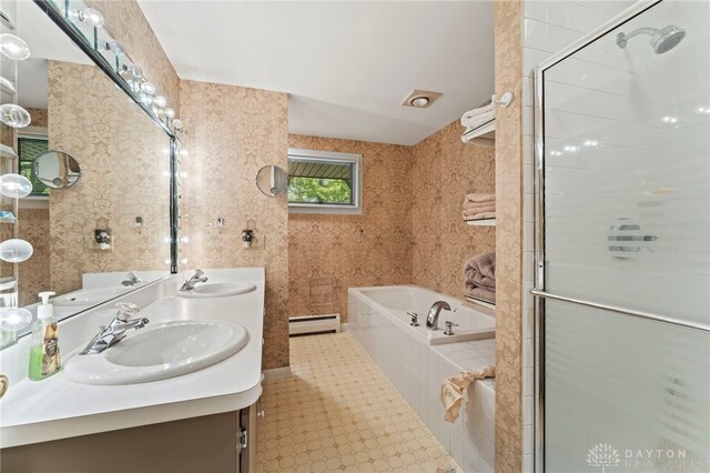 347 Winding Trl, Xenia, OH 45385 - bathroom with a garden tub, a baseboard radiator, double vanity, and a shower stall