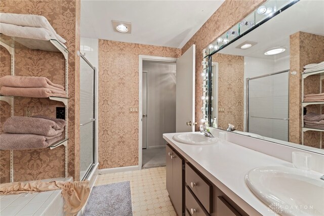 347 Winding Trl, Xenia, OH 45385 - full bathroom with a stall shower, double vanity, wallpapered walls, and tile patterned floors