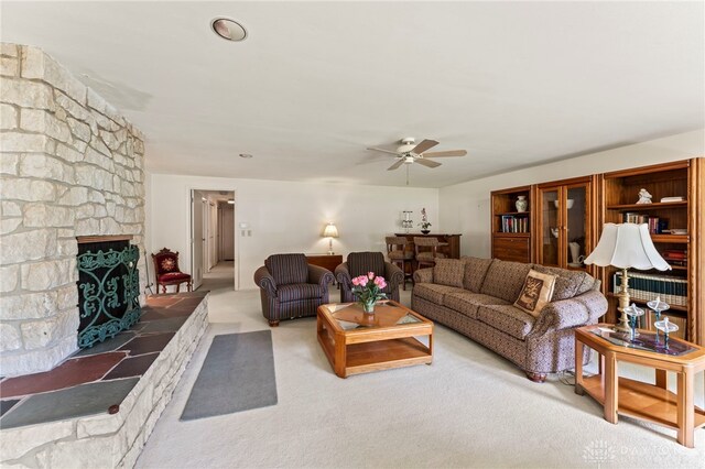 347 Winding Trl, Xenia, OH 45385 - living area with ceiling fan, carpet flooring, a large fireplace, and radiator