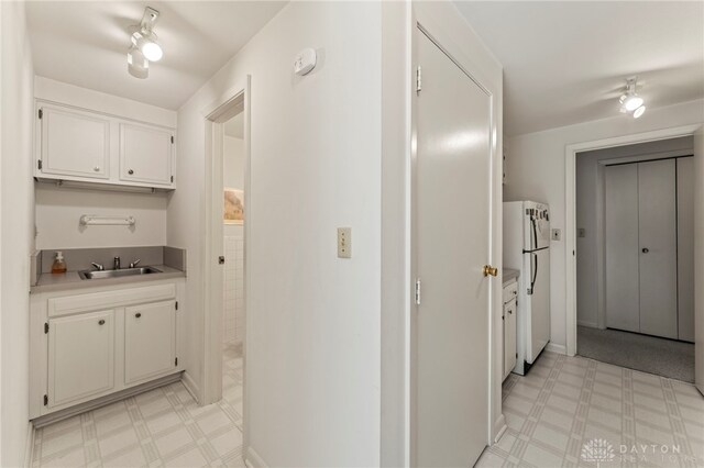 347 Winding Trl, Xenia, OH 45385 - hallway with a sink and light floors