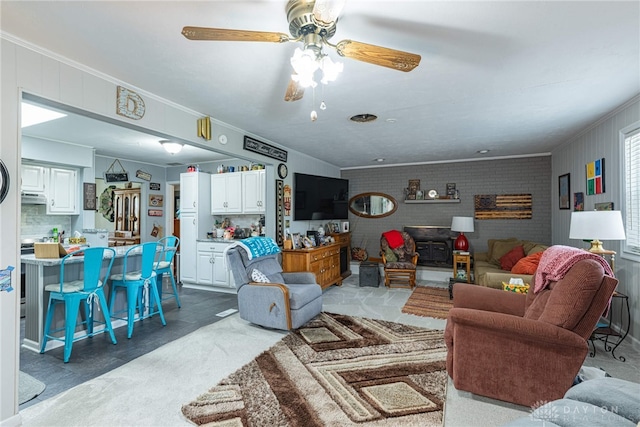 1808 Burnside Dr, Miamisburg, OH 45342 - living area with crown molding, ceiling fan, and brick wall