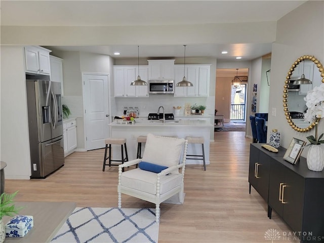 543 Buckeye St, Miamisburg, OH 45342 - living room with light wood-type flooring, recessed lighting, and a chandelier