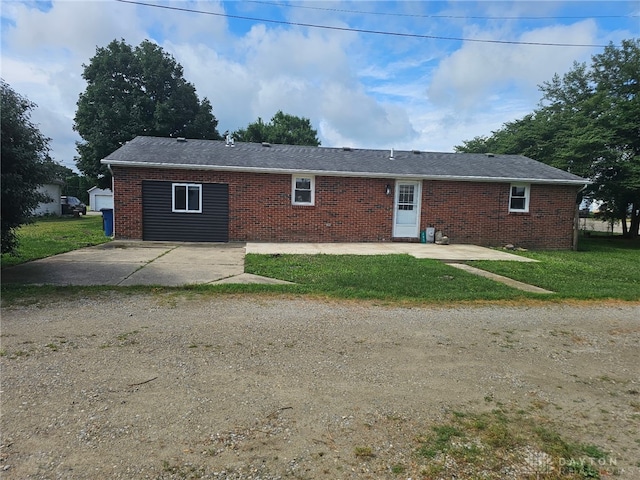 283 Moore St, Lewisburg, OH 45338 - view of front of property featuring brick siding, a front yard, and a patio