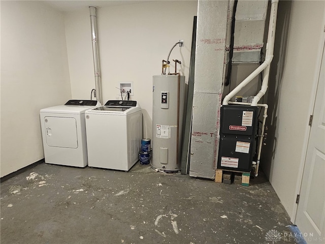 283 Moore St, Lewisburg, OH 45338 - laundry area with water heater, washing machine and dryer, and heating unit