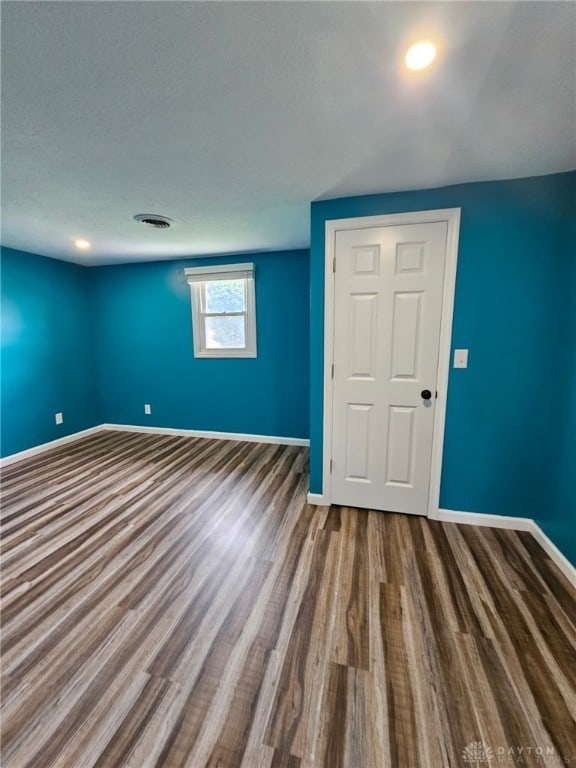 283 Moore St, Lewisburg, OH 45338 - spare room featuring baseboards and wood finished floors