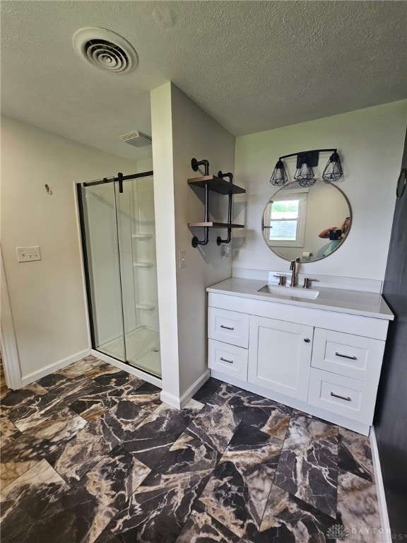 283 Moore St, Lewisburg, OH 45338 - full bathroom featuring a shower stall, a textured ceiling, vanity, and marble look tiles