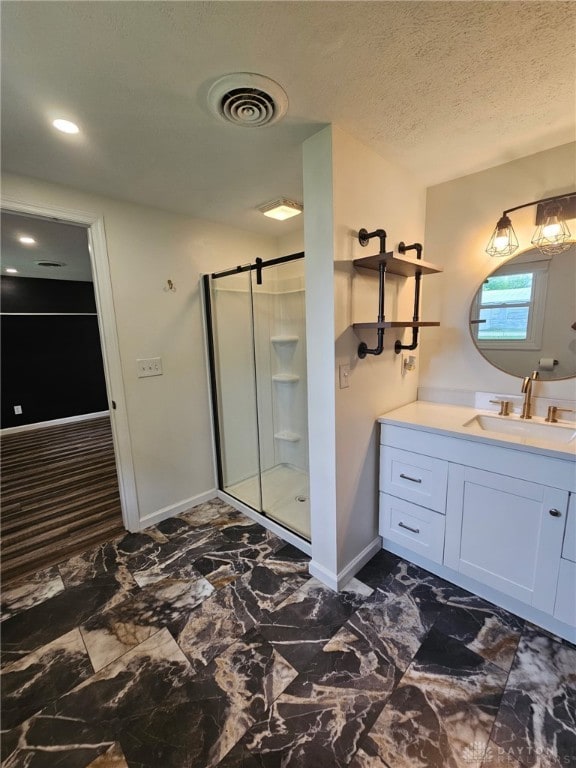 283 Moore St, Lewisburg, OH 45338 - full bath with a shower stall, vanity, and a textured ceiling