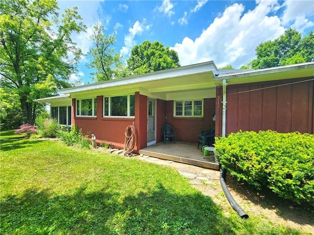 851 E County Line Rd, Springfield, OH 45502 - rear view of house with a yard and brick siding