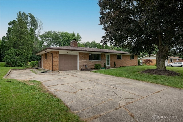 3442 Longleaf Ave, Beavercreek, OH 45430 - ranch-style home featuring an attached garage, a chimney, driveway, a front yard, and brick siding