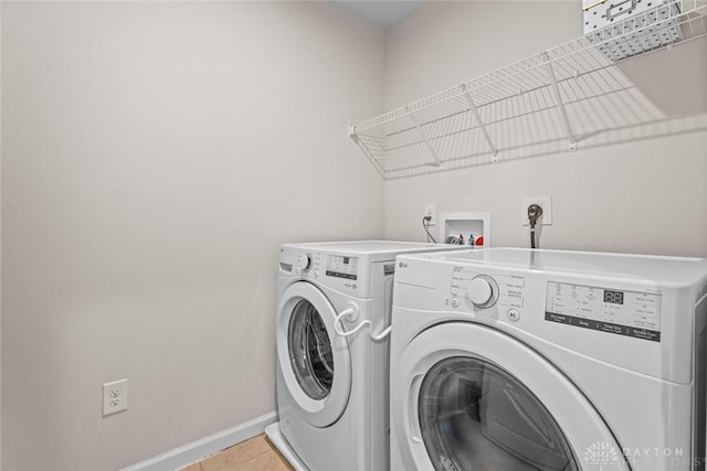 1835 Winding Run, Clearcreek Twp, OH 45458 - laundry room with washing machine and clothes dryer and light tile patterned flooring