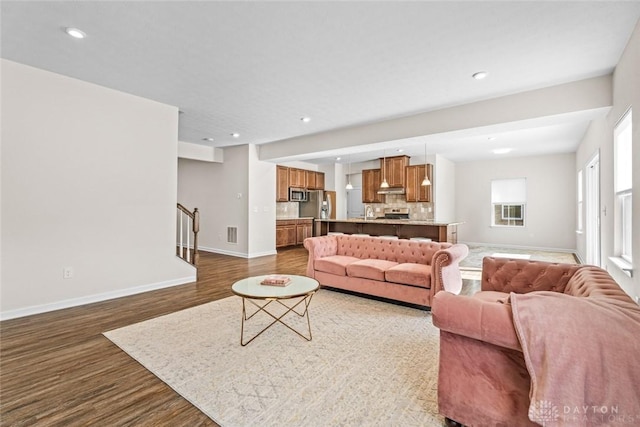 1835 Winding Run, Clearcreek Twp, OH 45458 - living room featuring dark wood-style floors, stairs, and recessed lighting