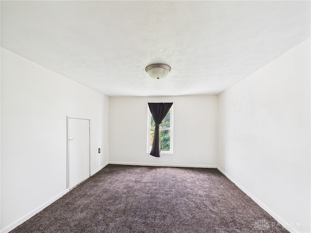 491 Frazers Rd, West Manchester, OH 45382 - unfurnished room with dark carpet and baseboards