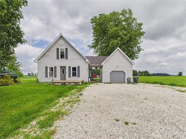 491 Frazers Rd, West Manchester, OH 45382 - view of front of house with gravel driveway, a garage, and a front yard