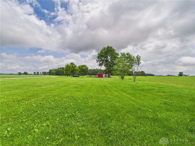 491 Frazers Rd, West Manchester, OH 45382 - view of grassy yard featuring a rural view and a storage shed