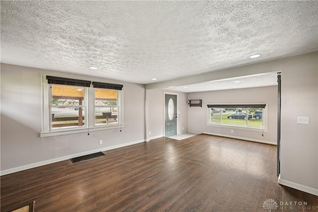3579 Alberta St, Columbus, OH 43228 - unfurnished living room featuring wood finished floors, a textured ceiling, and recessed lighting