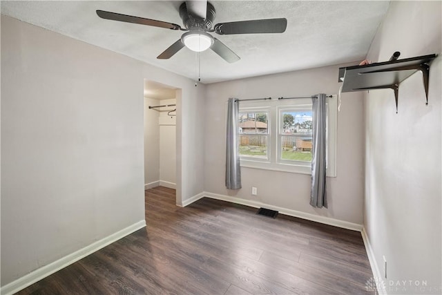3579 Alberta St, Columbus, OH 43228 - unfurnished bedroom with a spacious closet, wood finished floors, a ceiling fan, and a closet
