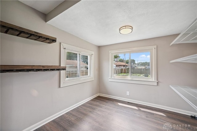 3579 Alberta St, Columbus, OH 43228 - unfurnished dining area with wood finished floors and a textured ceiling