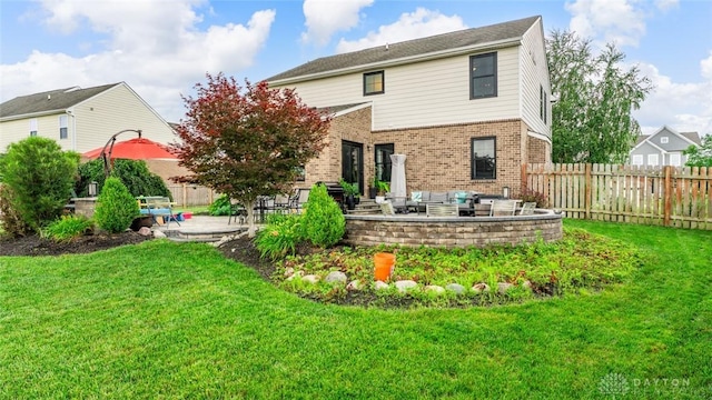 1950 Stone Creek Blvd, Clearcreek Twp, OH 45458 - back of house with a patio, an outdoor hangout area, and brick siding