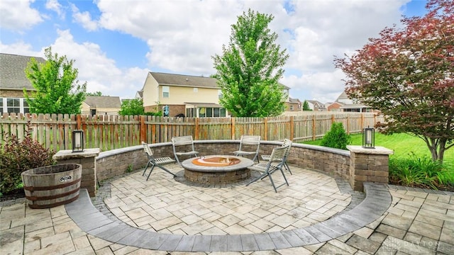 1950 Stone Creek Blvd, Clearcreek Twp, OH 45458 - fenced backyard with an outdoor fire pit, a patio, and a residential view