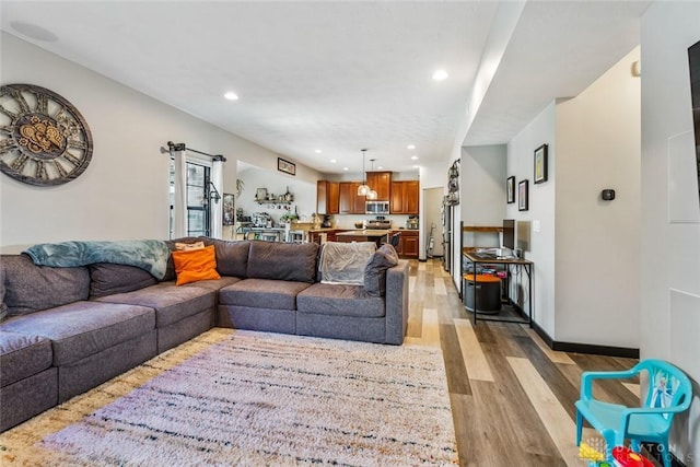 1950 Stone Creek Blvd, Clearcreek Twp, OH 45458 - living room featuring light wood-style floors and recessed lighting