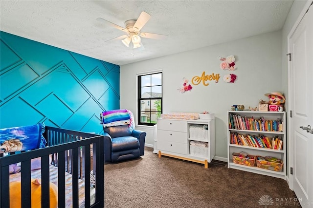 1950 Stone Creek Blvd, Clearcreek Twp, OH 45458 - bedroom with carpet flooring, a crib, a textured ceiling, and ceiling fan