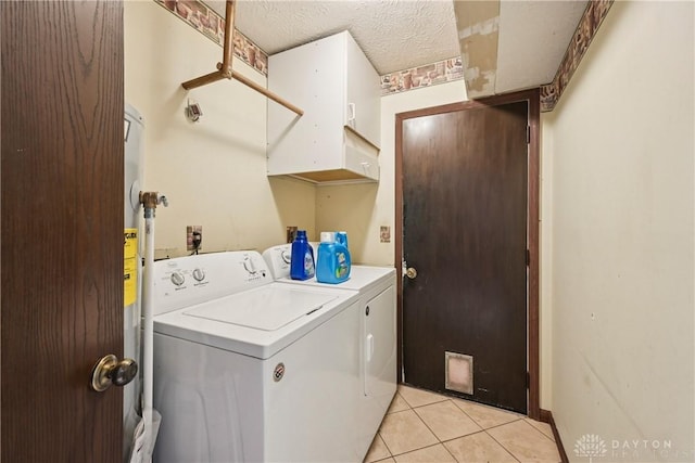 4595 Comanchee Trl, Silver Creek Twp, OH 45335 - washroom with separate washer and dryer and light tile patterned flooring