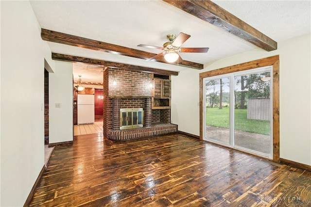 4595 Comanchee Trl, Silver Creek Twp, OH 45335 - unfurnished living room with wood-type flooring, beamed ceiling, a fireplace, and a ceiling fan