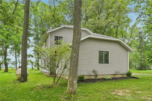 4595 Comanchee Trl, Silver Creek Twp, OH 45335 - view of side of home featuring a yard