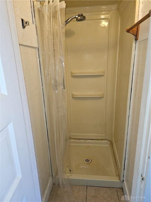 4009 E 3rd St, Dayton, OH 45403 - full bathroom with a stall shower and tile patterned floors