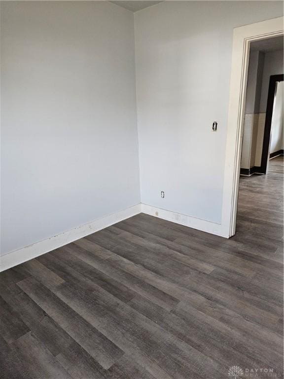 4009 E 3rd St, Dayton, OH 45403 - empty room with dark wood finished floors and baseboards